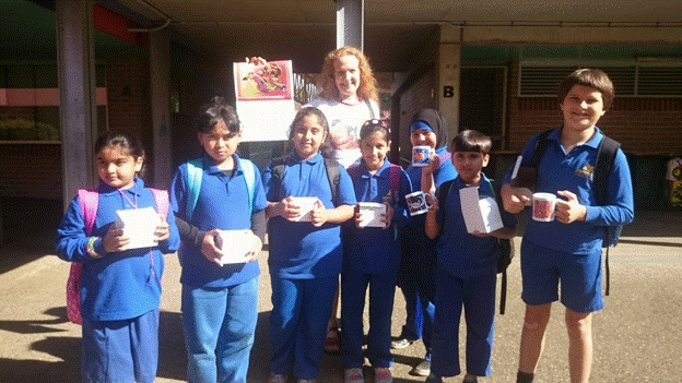Seven of the 21 VAP 2014 winners from Hampden Park Public School in Lakemba NSW, with Elizabeth O�Brien of The LEAD Group. L to R: Fatima Syed (aged 9), Zahra Naisa Lativa, Izzah Hussain, Raita Islam, Leyanna Flaifel, Abdur Rehman (all aged 8) and Leonard Carey (9).